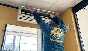 Illustrative maintenance work on an indoor wall-mounted HVAC unit
